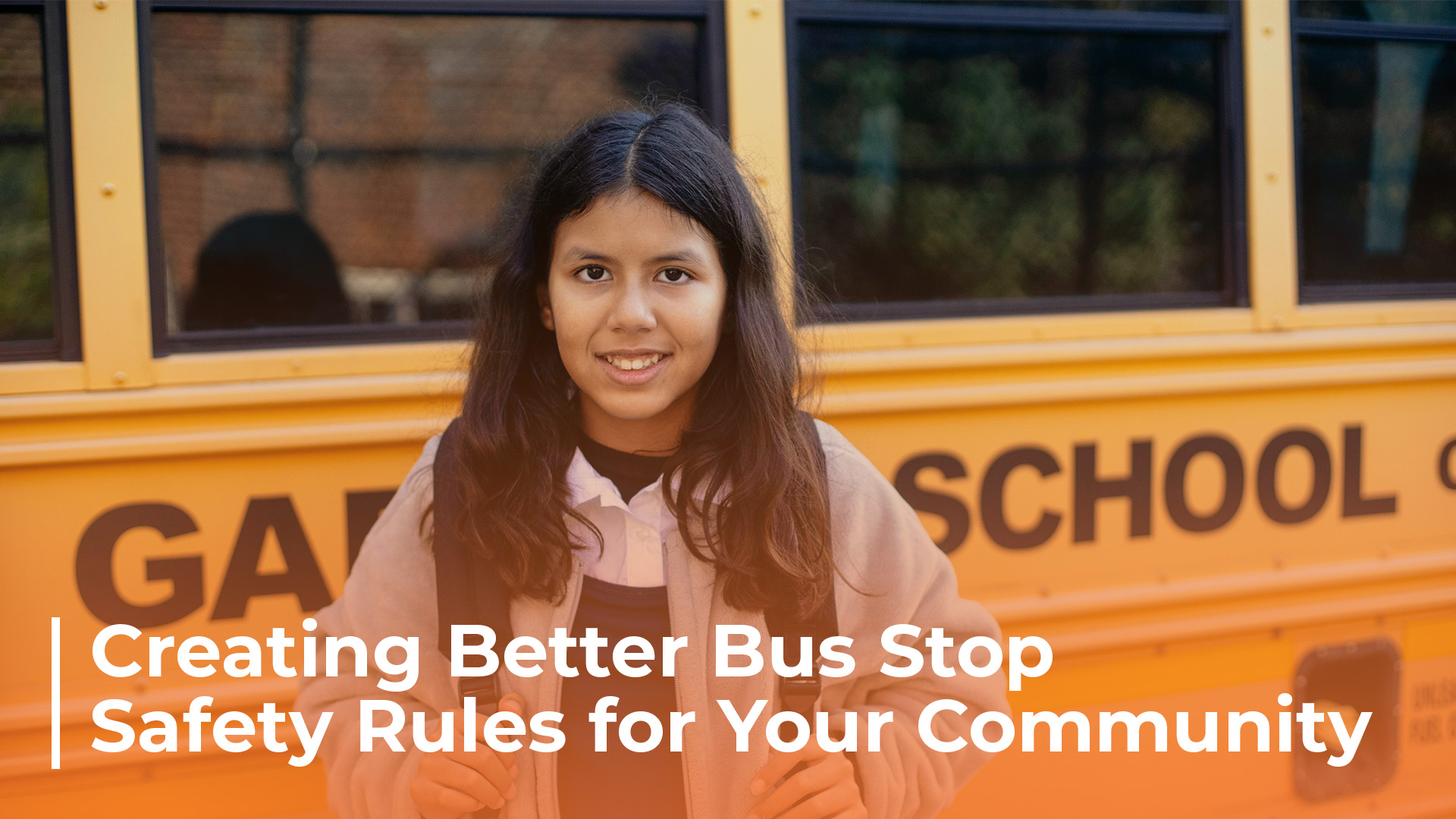 a child smiles while standing in front of a school bus text reads creating better bus stop safety rules for your community