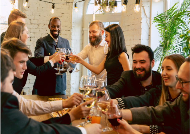 a group of people clinking glasses